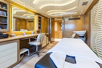 A salon with a table and chairs and a sink