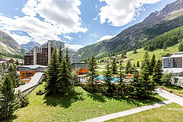A balcony with a view of a mountain range