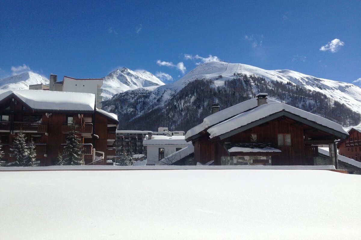 A bedroom with bunk beds and a stool