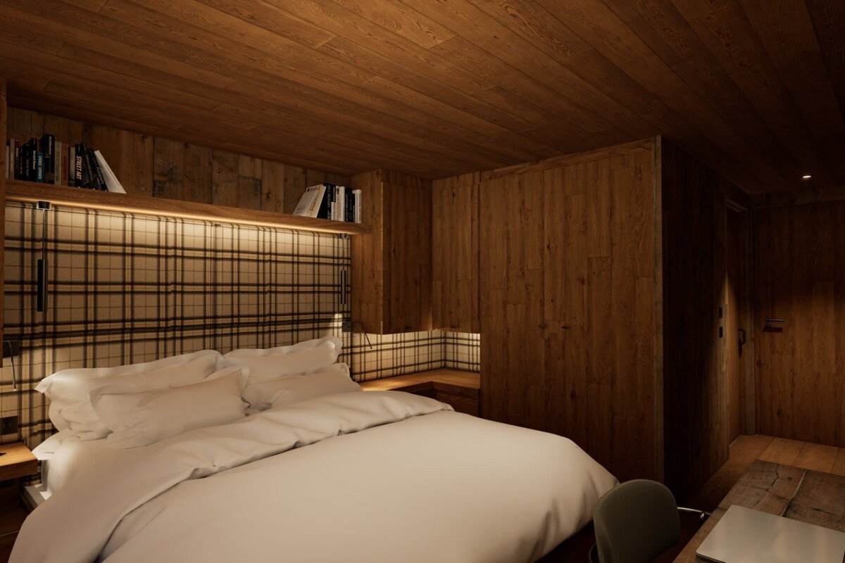A bedroom with a plaid headboard and a bed