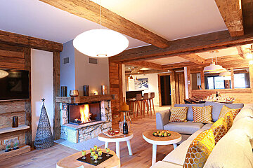 A living room with a fireplace and a couch