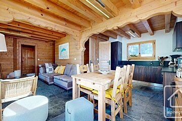 A wooden house with the word alpine on the bottom right