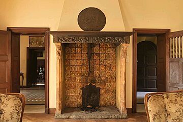 A fireplace with a shield on top of it