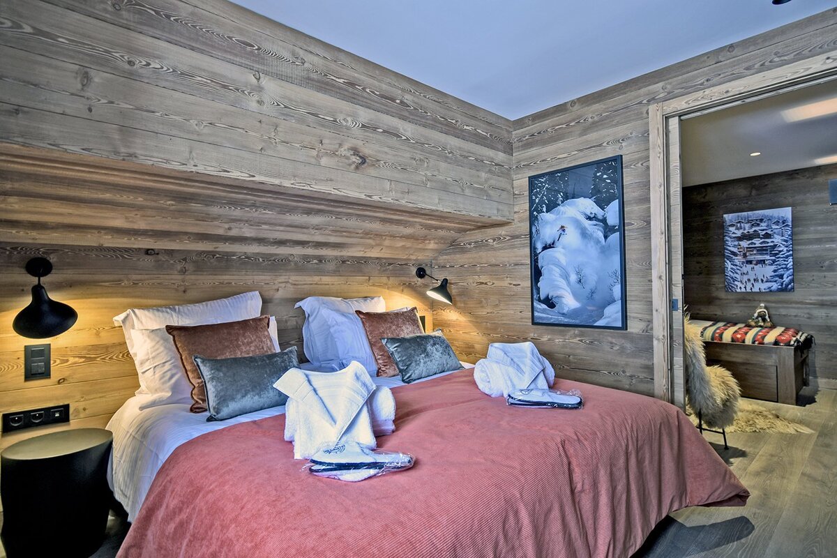 A bedroom with a painting of a polar bear on the wall