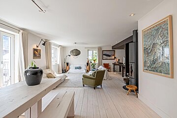 A living room with a map on the wall that says