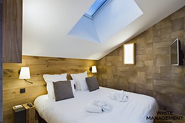 A bathroom with a toilet a sink and a shower