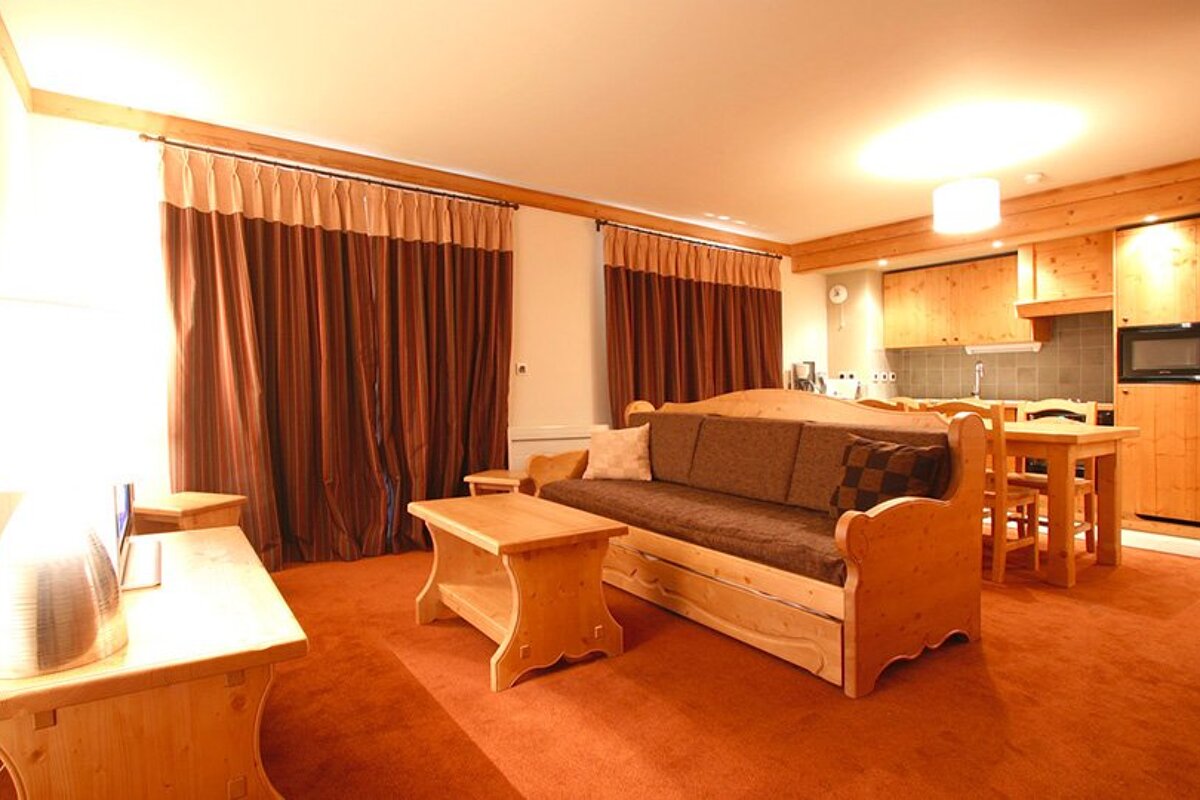 A living room with a couch and a table