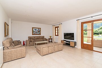 A living room filled with furniture and a flat screen tv