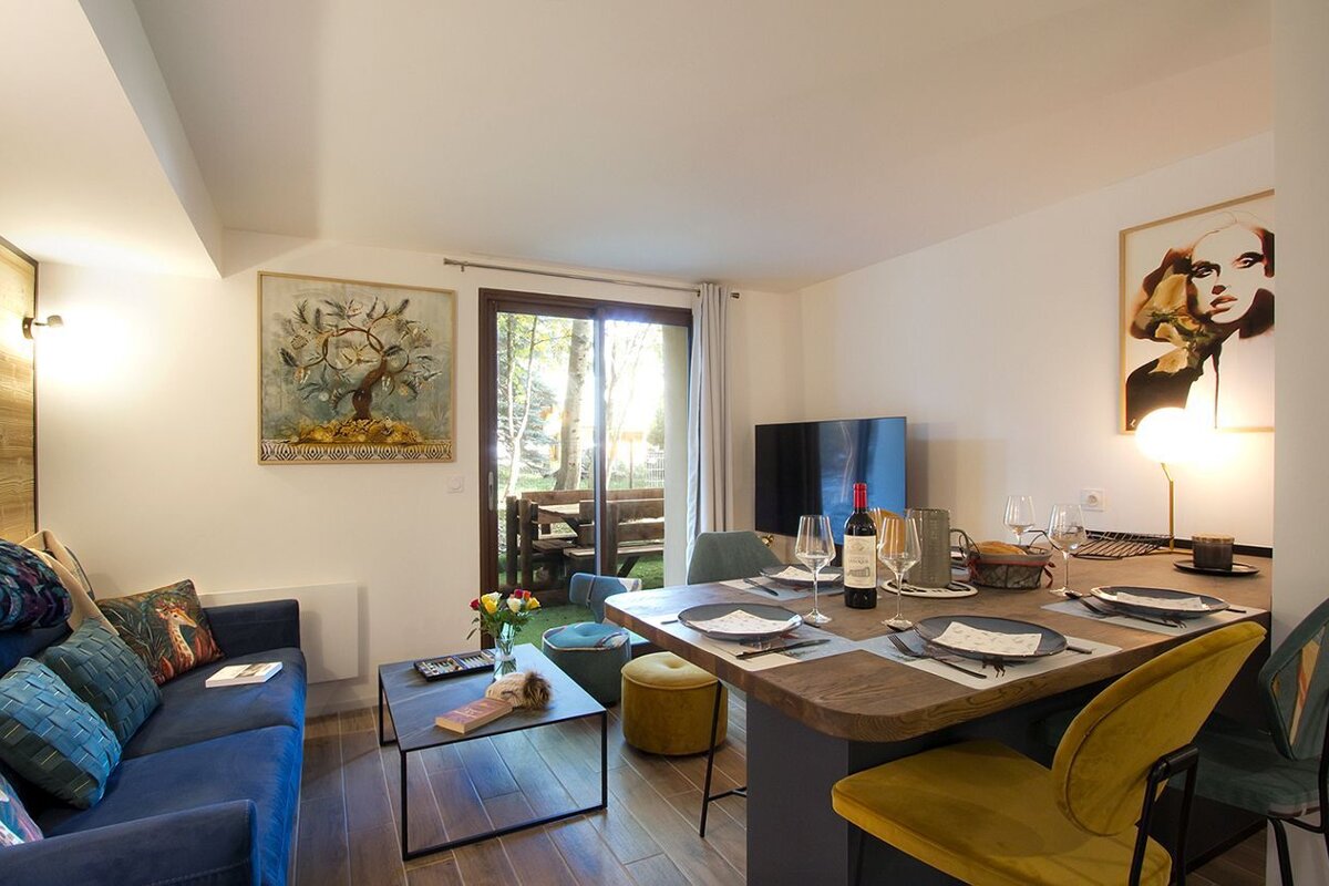 A bottle of wine sits on a table in a living room