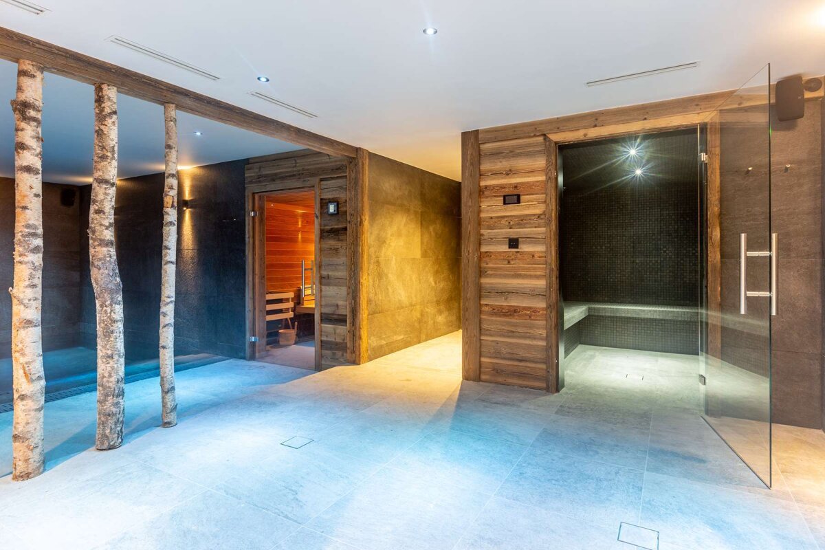 A room with a sauna and a steam room