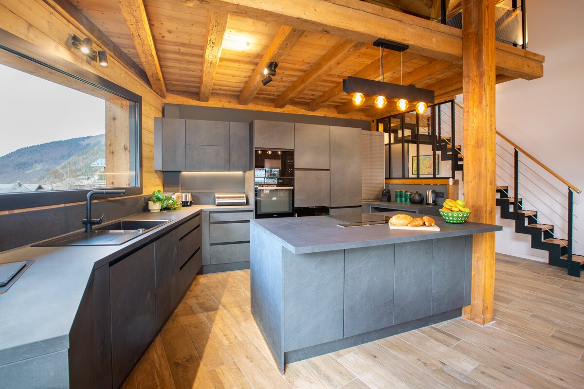 A kitchen with a large island in the middle