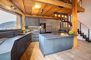 A kitchen with a large island in the middle