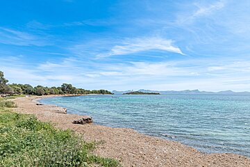 A large body of water with mountains in the background