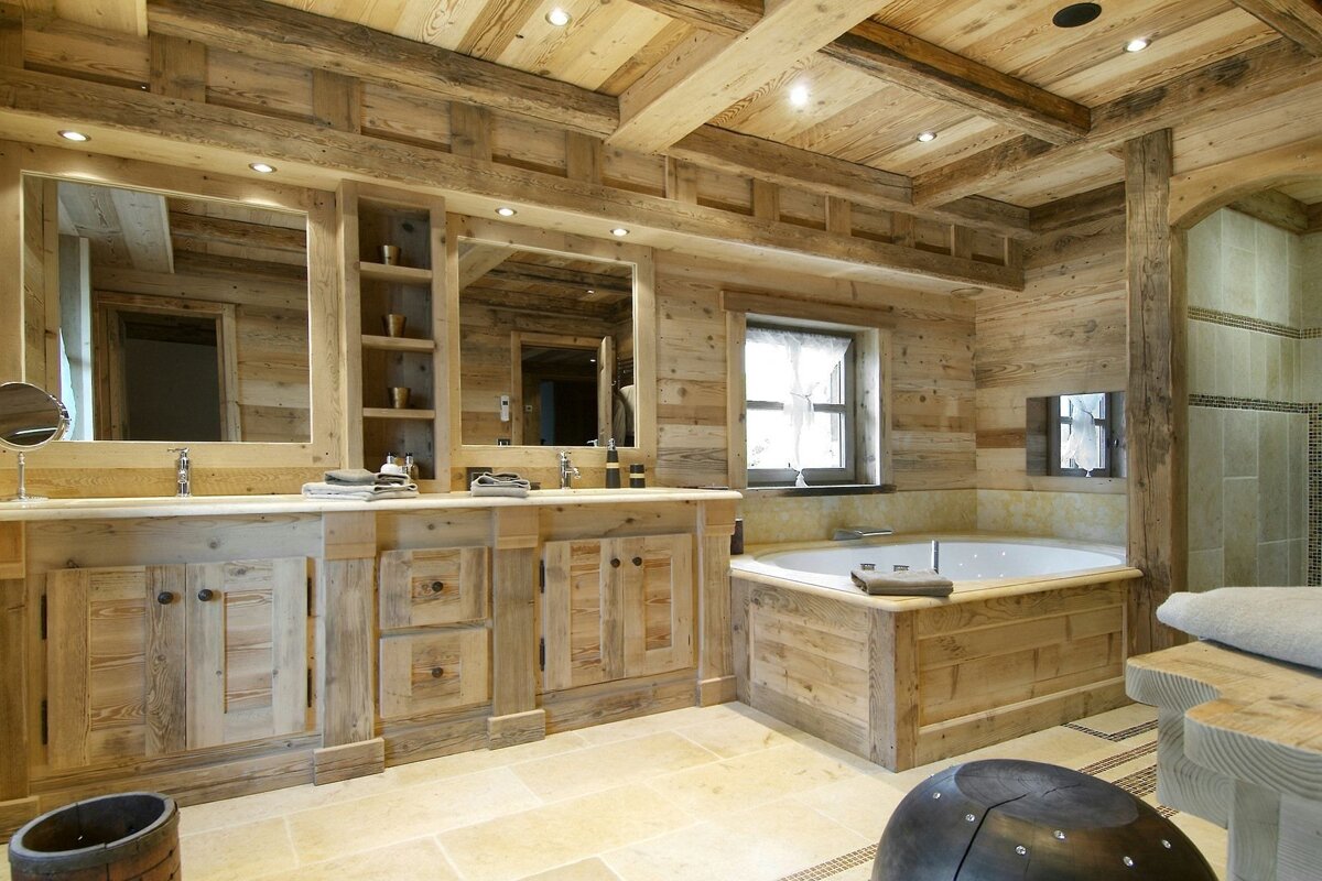 A bathroom with wooden cabinets and a bathtub