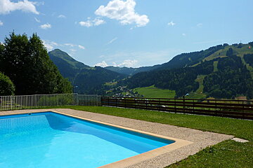 A swimming pool with a view of mountains in the background