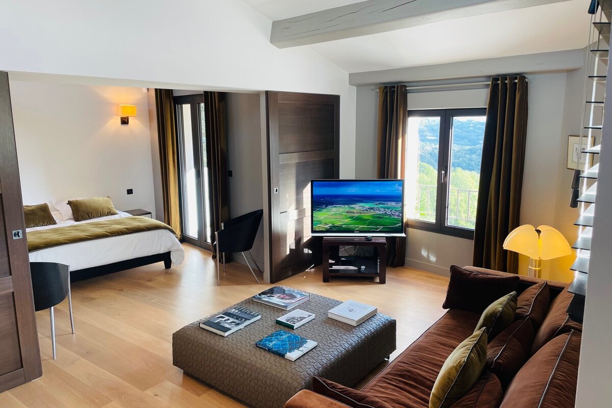 A living room with a couch and a flat screen tv