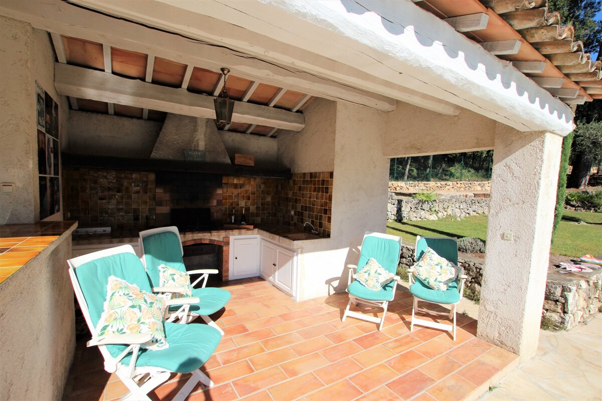 A kitchen with a sign on the wall that says ' a ' on it