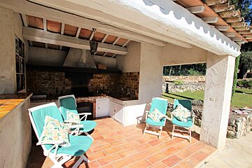 A kitchen with a sign on the wall that says ' a ' on it