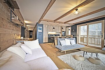 A living room with a couch and two coffee tables