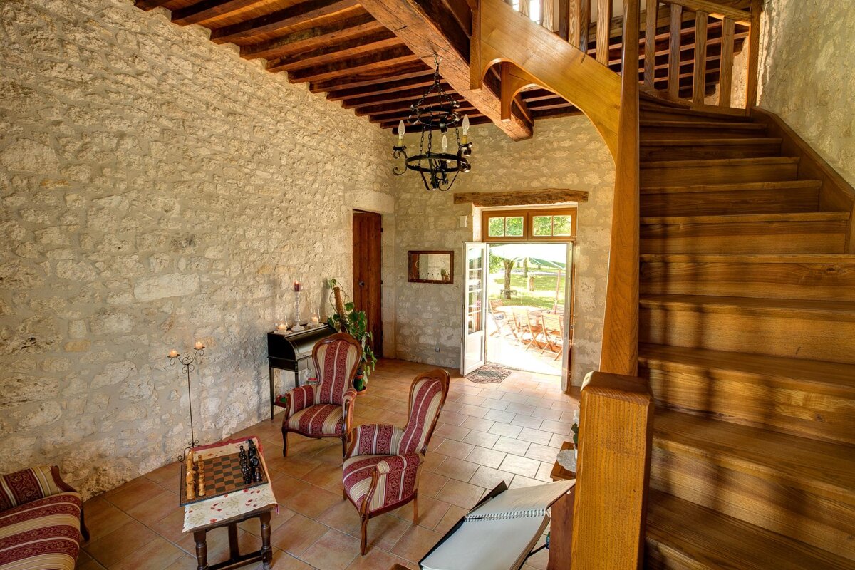 A wooden staircase leading up to the second floor of a house