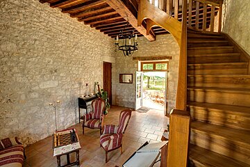 A wooden staircase leading up to the second floor of a house