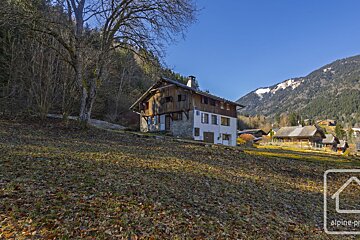 A picture of a house in the mountains taken by alpine-pro