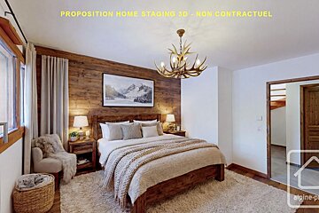 A warm, rustic bedroom with a wooden bed, wood-paneled wall, fuzzy rug, and antler chandelier, creating a cozy, mountain chalet ambiance.