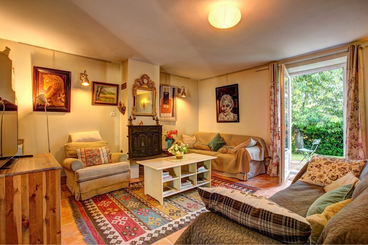 A living room with a couch a chair and a coffee table