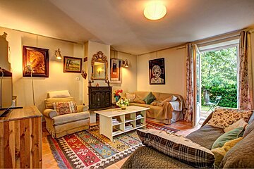 A living room with a couch a chair and a coffee table