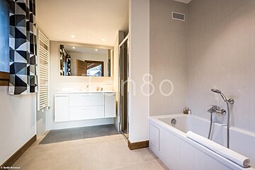 A bathroom with the number 80 on the wall