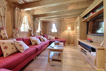 A living room with a couch and a flat screen tv
