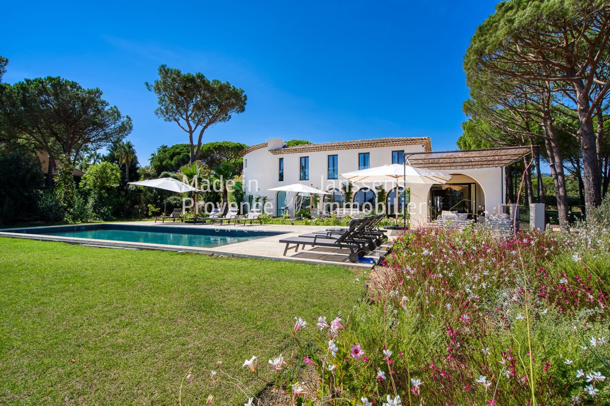 A large white house with a swimming pool is for sale by made in provence