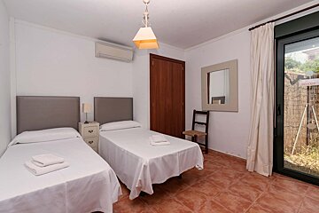 A bedroom with two beds and a sign that says no exit