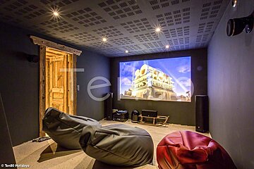 Bean bag chairs in front of a screen that says 20th century fox