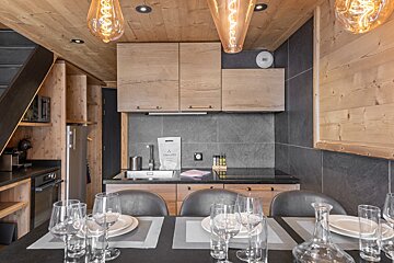 A kitchen with a bag that says