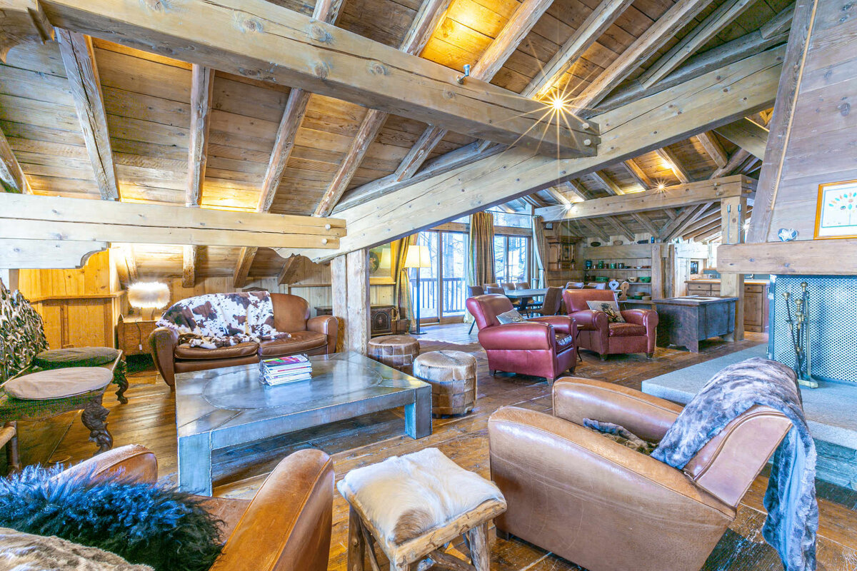 A living room with chairs and a coffee table