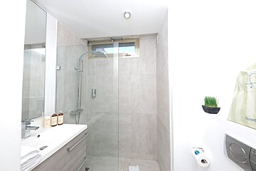 A bathroom with a bag that says stevens on it