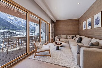 A living room with a couch and a chair