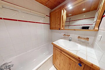 A bathroom with a sink and a bathtub