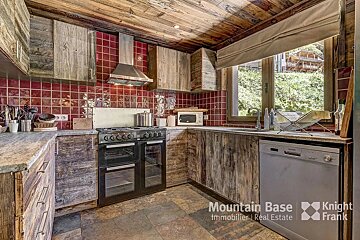 A kitchen with wooden cabinets and a dishwasher from mountain base