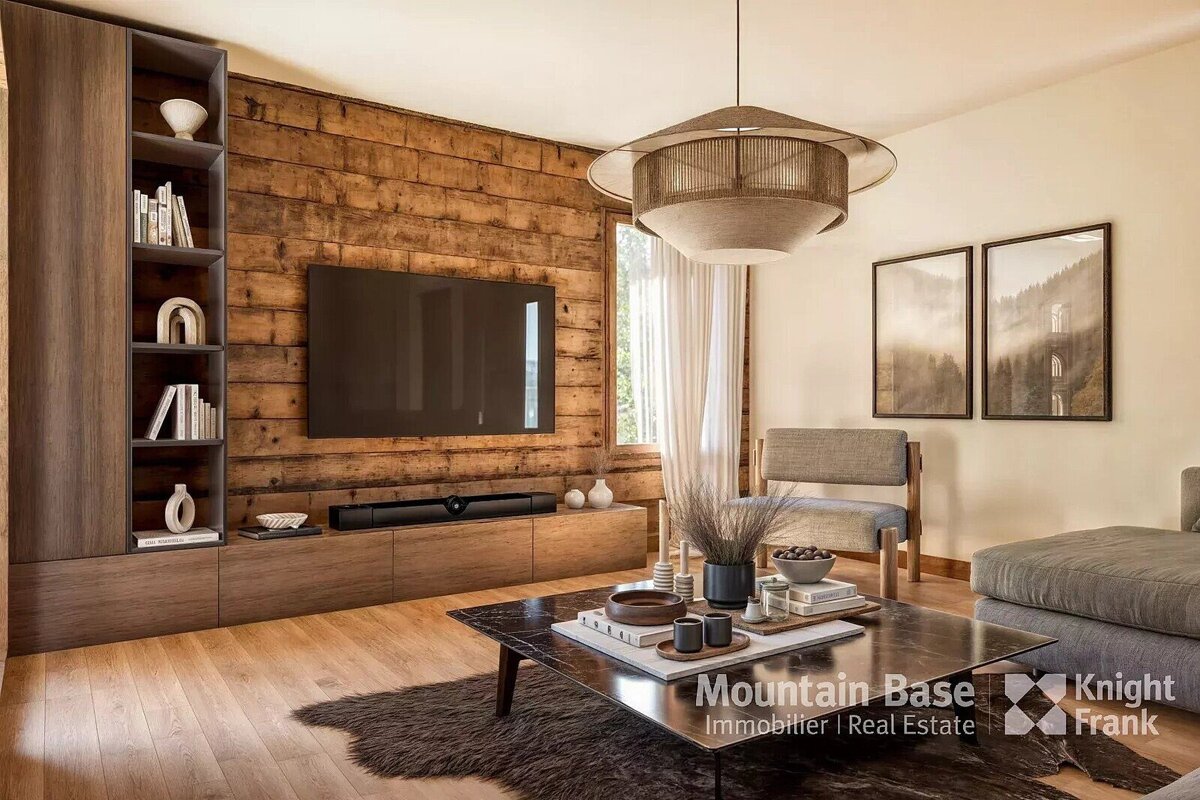 A living room with a flat screen tv and a knight frank logo