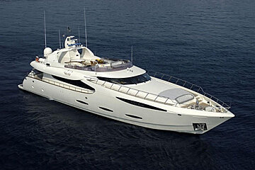 A large white yacht is floating in the ocean