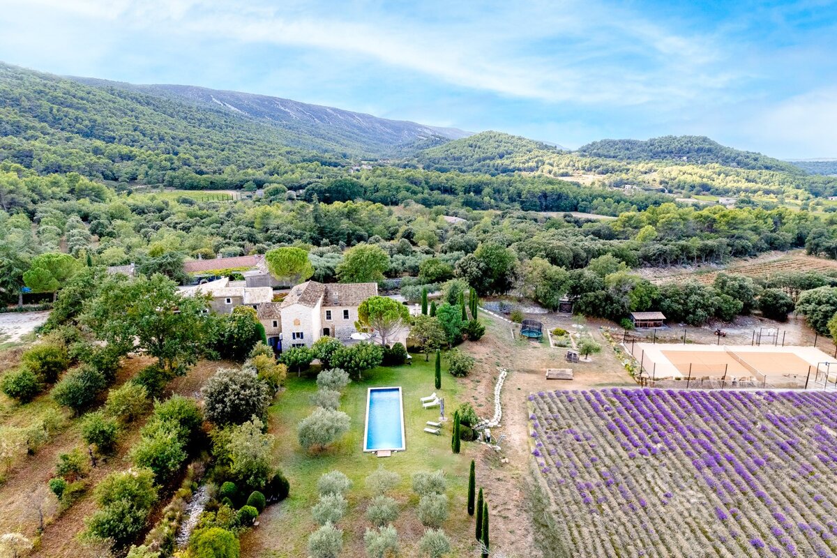 An aerial view of a house surrounded by lavender fields