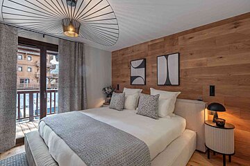 A hot tub in a room next to a sauna