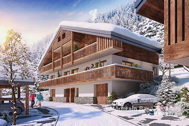 A modern chalet-style apartment building with wooden balconies sits in a snowy mountain landscape. People, snow-covered cars, and a snowman are visible.