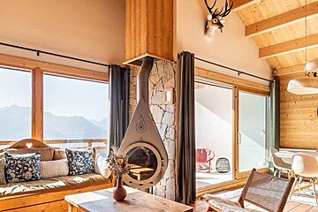 A living room with a fireplace and a couch