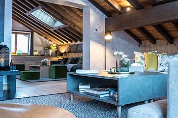 A living room with a table and books on it