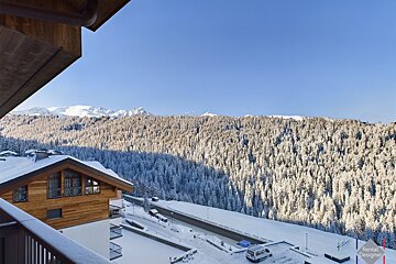 A view of snowy mountains from a rental designer