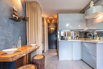 The word art is on the wall above the kitchen