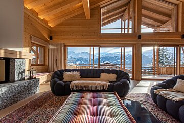 A living room with a view of the mountains